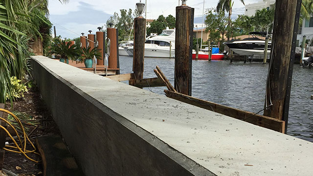 What is the first thing you should do if you are considering working on your seawall or dock?